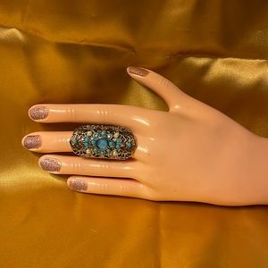 Gold colored ring with faux pearls & blue gems.size 7-Costume jewelry